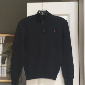 Kid’s navy Polo sweater.